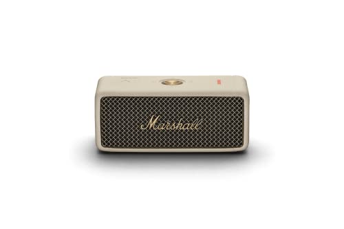 Cream-colored portable speaker with a textured grille, gold "Marshall" logo, and a top control knob, featuring a compact rectangular design.