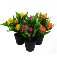 Artificial Freesia plants in black pots with pink, orange, and yellow flowers, 18cm tall.
