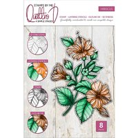 "Floral stamp set with orange flowers, green leaves, and layering guides on a wooden background"