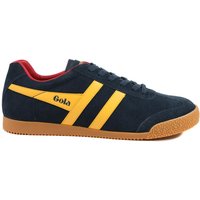 Navy suede trainers with yellow stripes, red lining, and gum sole, by Gola Classics.