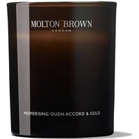 Dark brown Molton Brown candle with white text, labeled "Oudh Accord & Gold," in a sleek glass container.