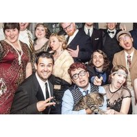 Virtual Murder Mystery Game cover with people in 1920s attire, including suits, flapper dresses, and a cat.