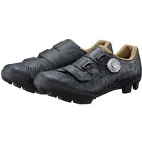 Black Shimano RX6W women's gravel cycling shoes with Velcro straps and dial closure, textured sole, and tan interior.