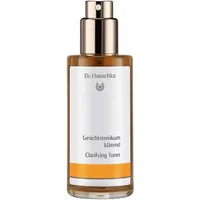Dr Hauschka Clarifying Toner 100ml in amber glass bottle with silver spray cap and white label with orange accent.