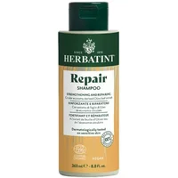 Herbatint Repair Shampoo 260ml bottle, green cap, white label with green and beige sections, text in black.