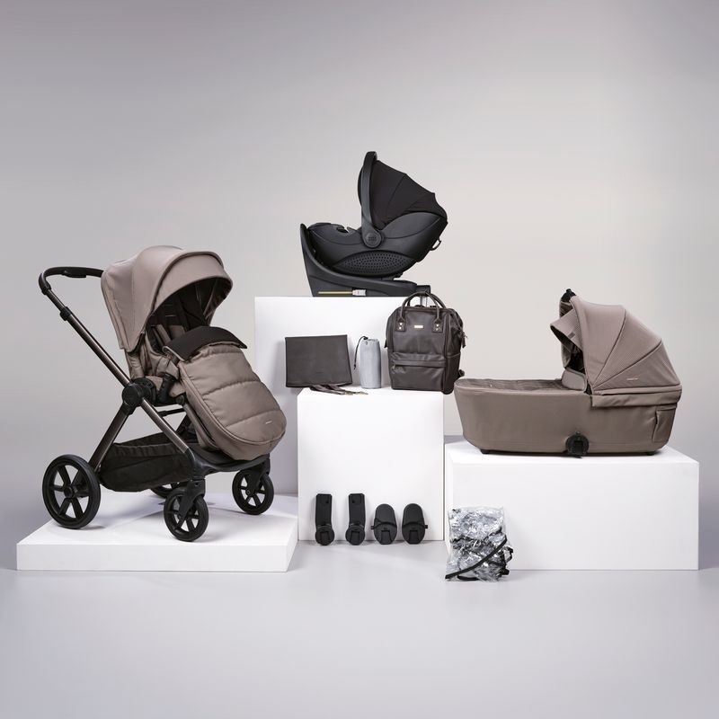 12-piece travel bundle in neutral taupe featuring a sleek stroller, car seat, Isofix base, changing bag, and accessories, all with modern design and durable materials.
