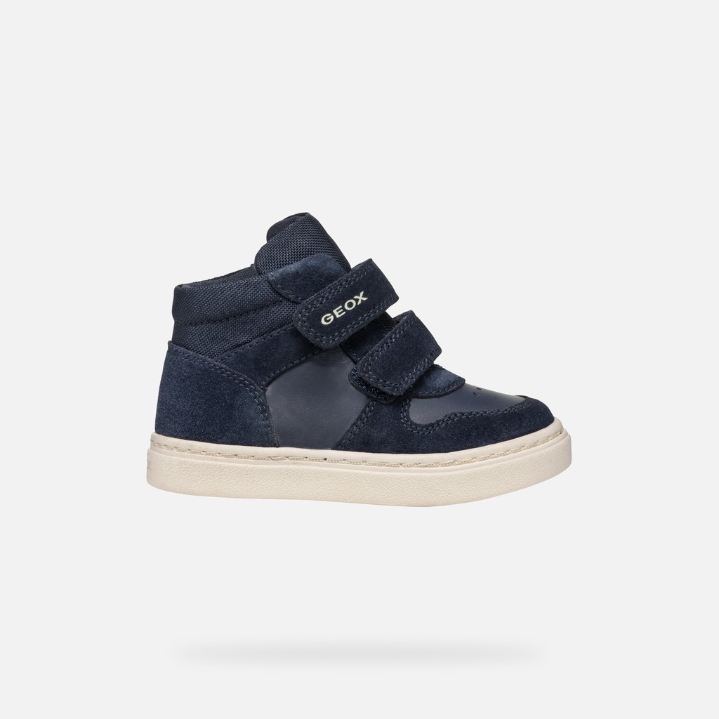 Navy blue Geox Nashik Petit Garçon shoes for boys, featuring a suede and synthetic upper, double Velcro straps, and a light-colored rubber sole, size 24.
