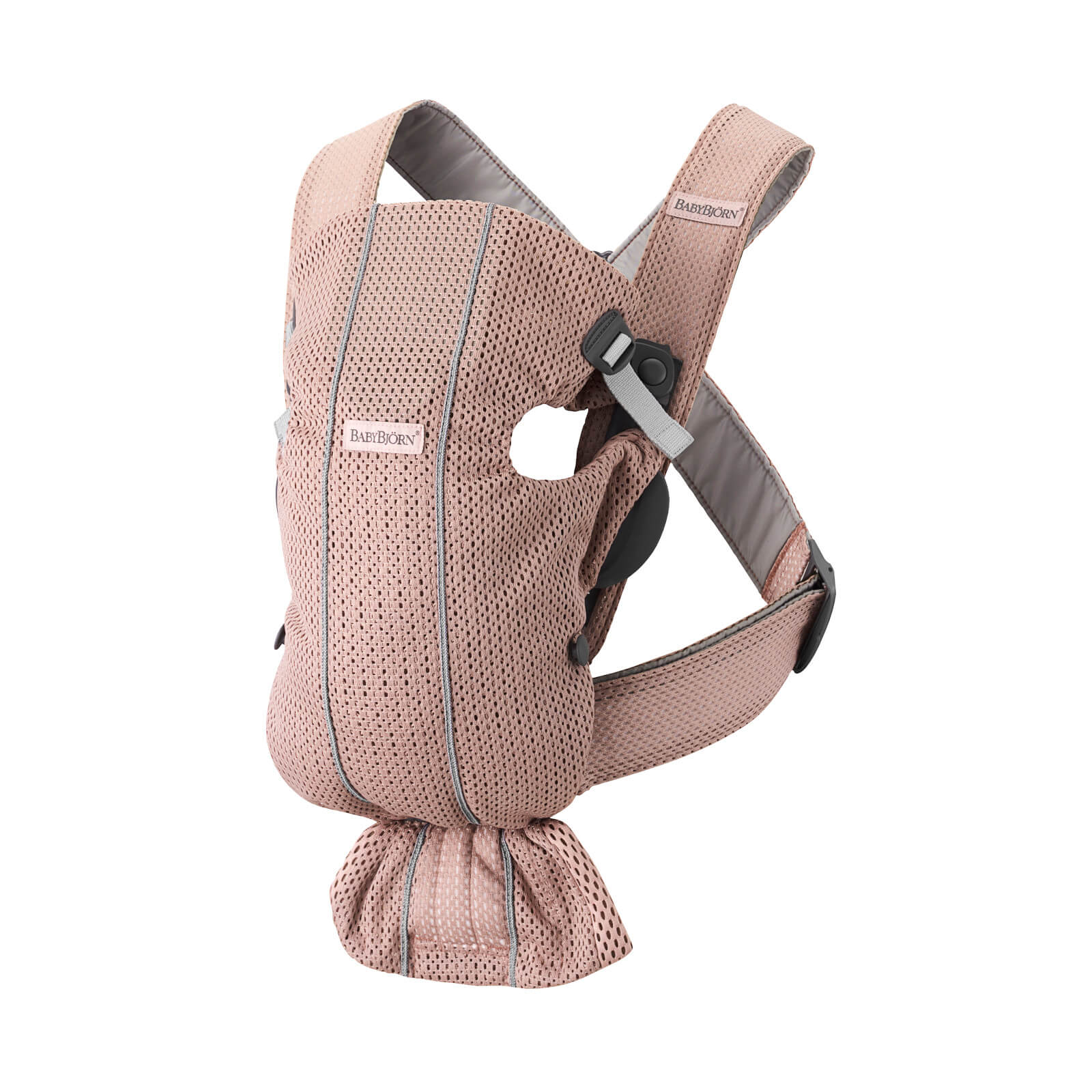 Dusty pink BabyBjörn Baby Carrier Mini made of breathable 3D mesh, featuring adjustable straps and a compact design for easy carrying and comfort.