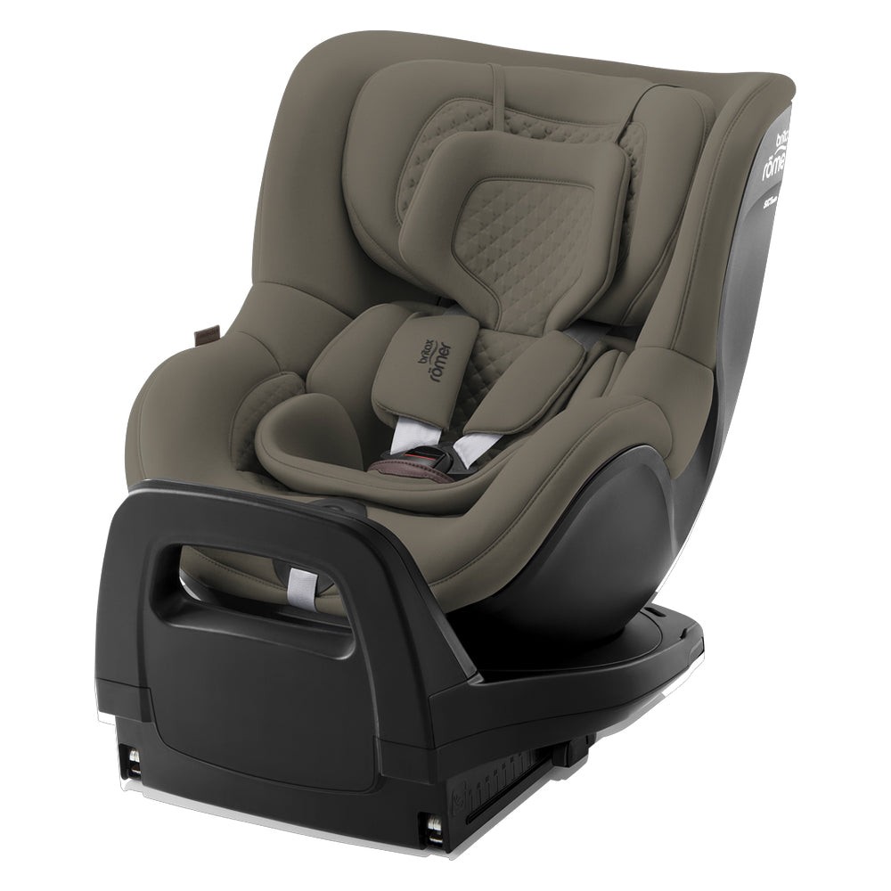 Britax Dualfix Pro M Lux car seat in a soft taupe color, featuring a padded seat, adjustable headrest, and a sturdy base designed for children aged 3 months to 4 years.