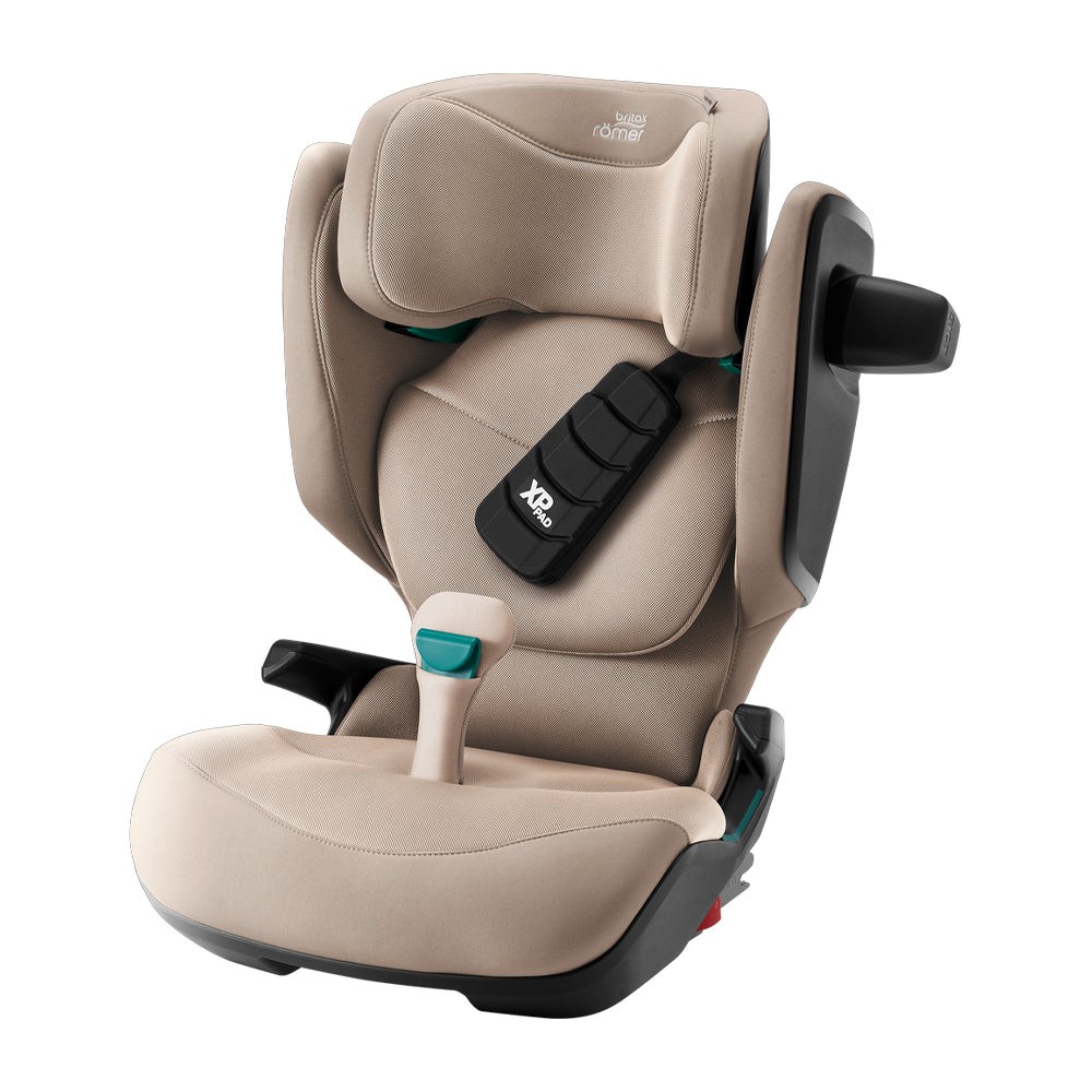 Britax KidFix Pro Style booster seat in beige fabric with a padded headrest, adjustable back, and integrated XP-PAD for added safety, suitable for children aged 3.5 to 12 years.