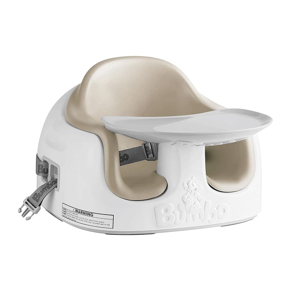Taupe and white Bumbo Multi Seat with a removable tray, adjustable straps, and a sturdy base, designed for infants and toddlers to sit securely.