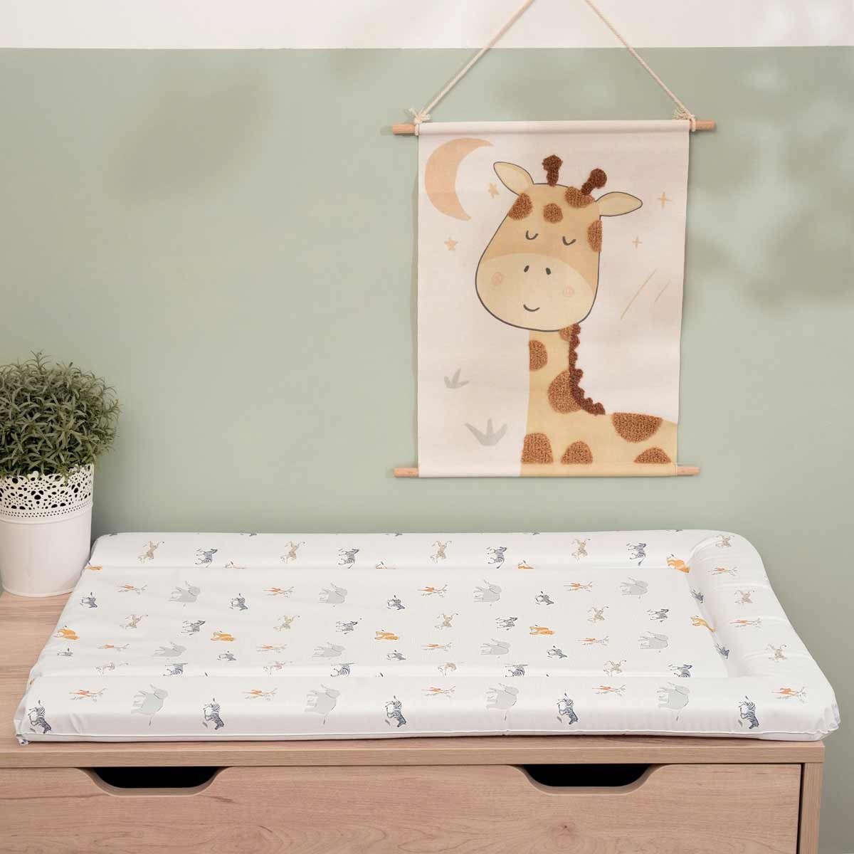 Soft, padded changing mat in a jungle theme featuring playful animal prints in pastel colors, with a waterproof surface and a raised edge for added safety.