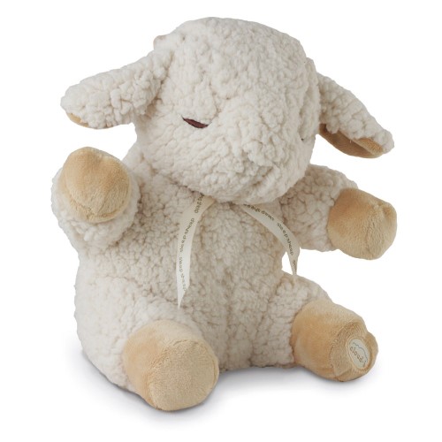 Soft, plush cream-colored sheep with tan accents, closed eyes, and a ribbon around its neck, designed to soothe babies to sleep with calming sounds.