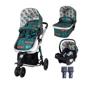 Cosatto Giggle 3 in 1 Pushchair Bundle features a vibrant green fabric with a floral pattern, includes a stroller seat, carrycot, and car seat, all with a sleek silver frame.