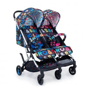 Cosatto Woosh Double Stroller in blue and purple, featuring vibrant "Bro & Sis" patterns, two adjustable canopies, and a lightweight frame with swivel wheels.