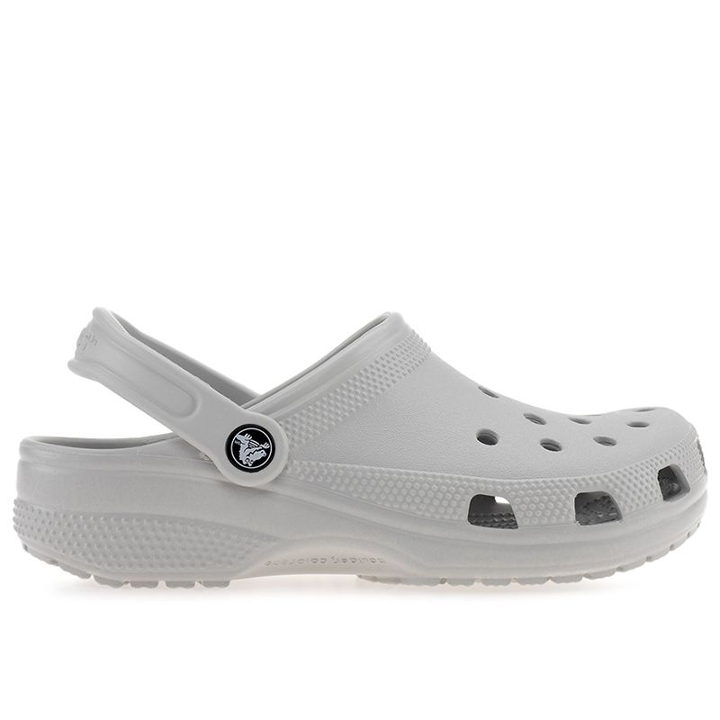 Atmosphere grey Crocs Kids Classic Junior Clogs featuring a lightweight design, ventilation holes, and a back strap for secure fit.
