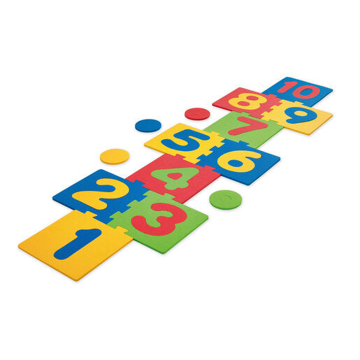 Colorful foam hopscotch mat featuring interlocking puzzle pieces in red, blue, yellow, and green, with large numbers 1 to 10 and circular markers for added play.