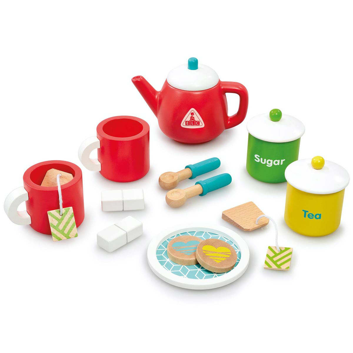 Brightly colored wooden tea set featuring a red teapot, two red cups, green and white sugar and tea canisters, wooden spoons, sugar cubes, and heart-shaped cookies on a patterned plate.