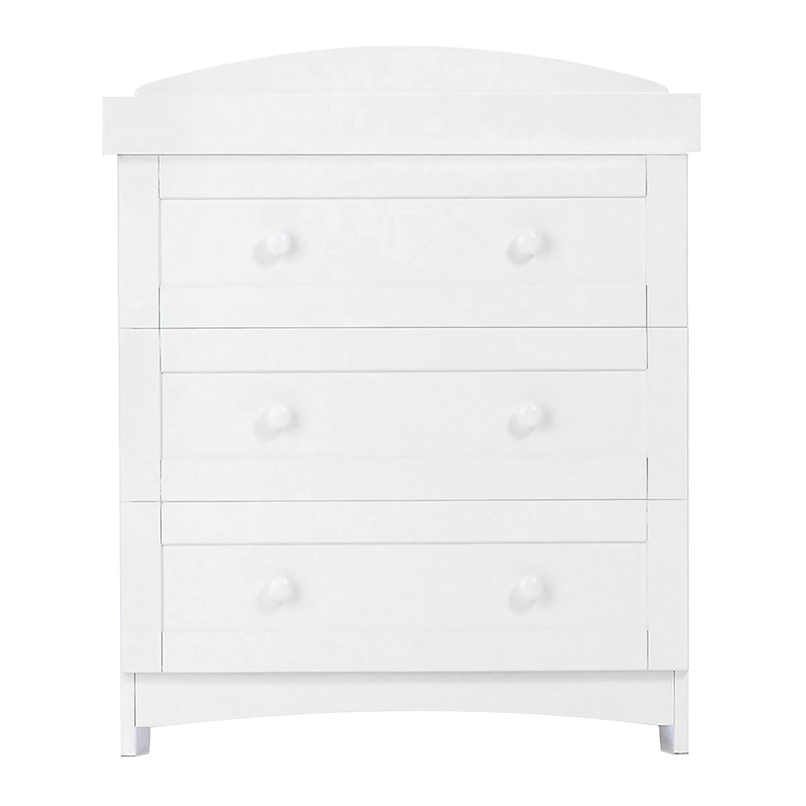 White wooden cotbed with a smooth finish, featuring a curved top and three spacious drawers with round knobs for storage.