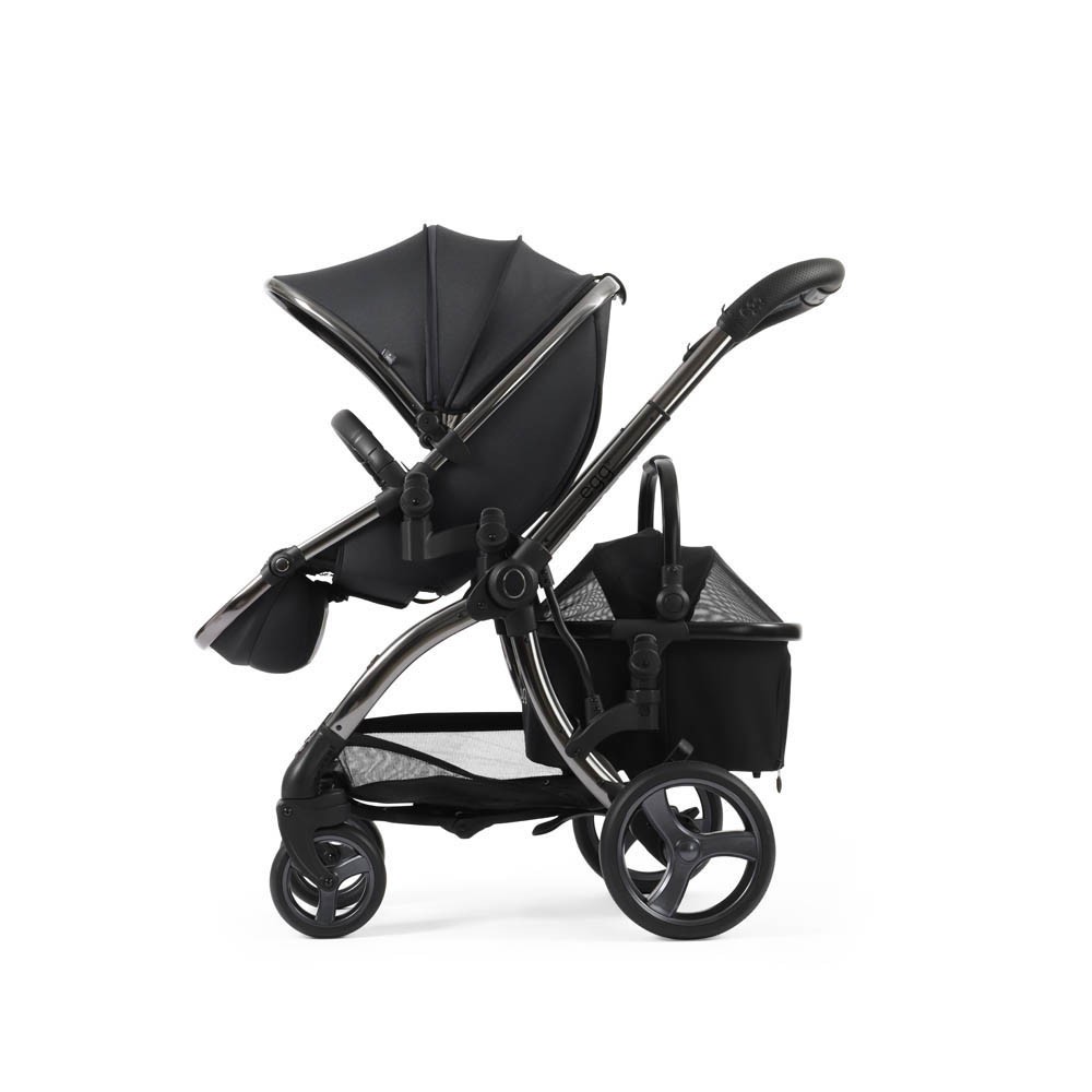 Black Egg Stroller with a sleek design, featuring a large canopy, adjustable handle, and a spacious mesh basket underneath for storage.