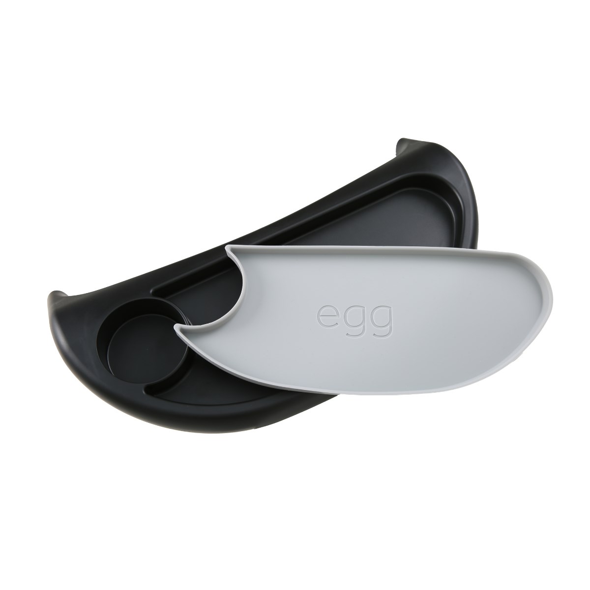 Black and gray egg snack tray featuring a curved design, with a compartment for eggs and a removable serving dish embossed with the word "egg."