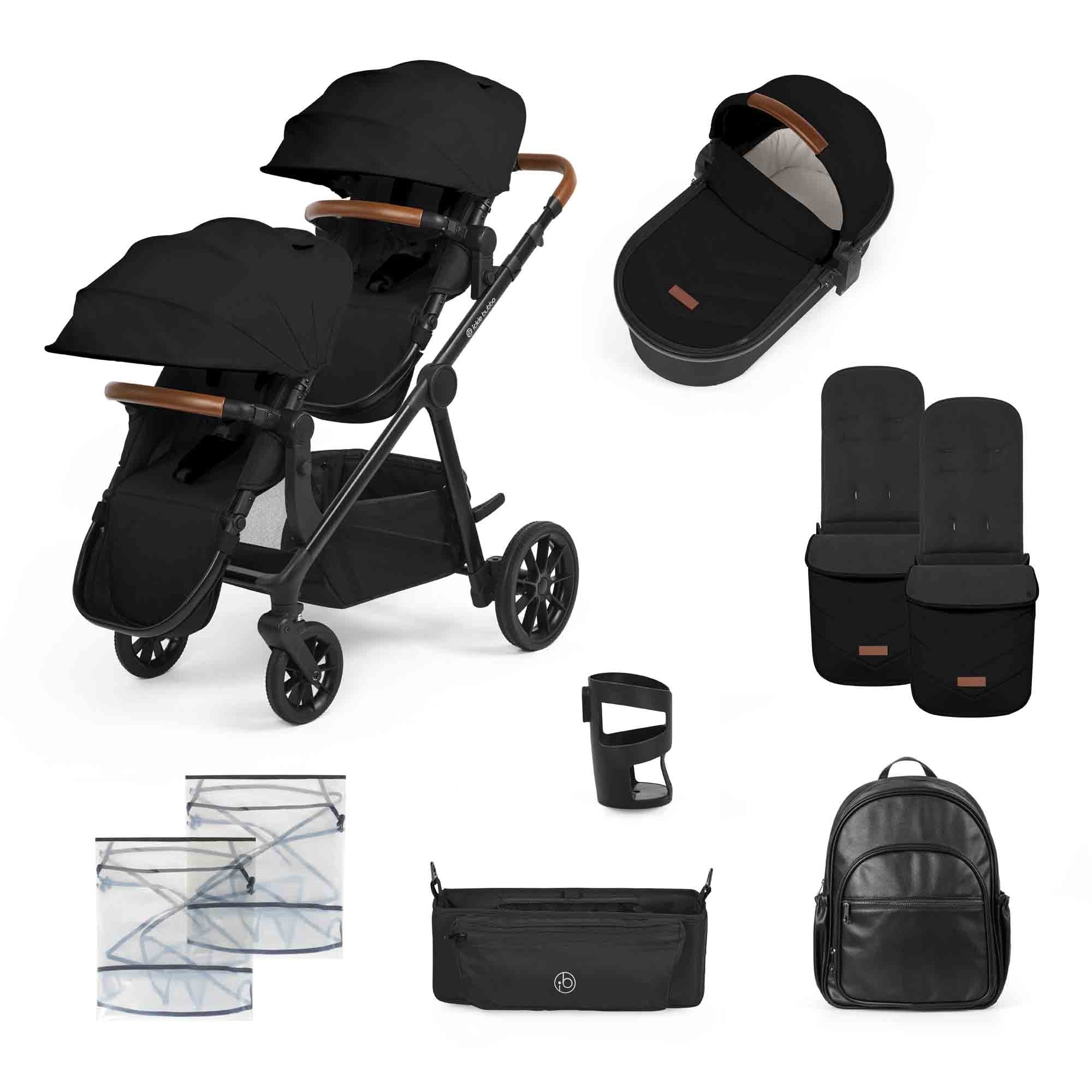 Black double stroller with wooden handles, two hoods, a detachable carrycot, padded seat liners, cup holder, storage bags, a zippered organizer, and a black backpack.