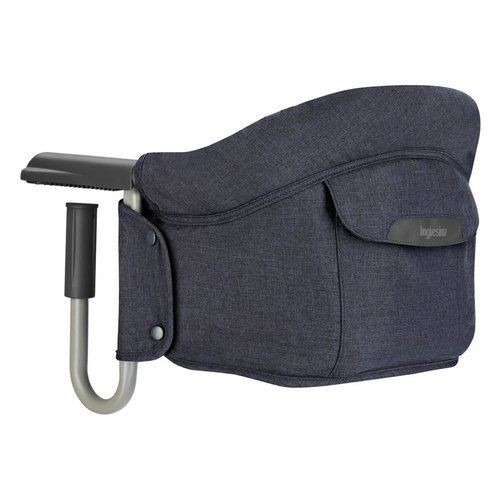 Navy blue fabric high chair with a sturdy metal clamp, featuring a side pocket and a sleek design, ideal for attaching to tables.