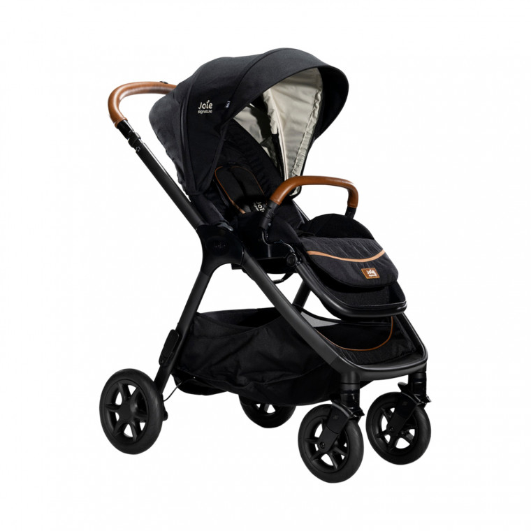 Joie Signature Finiti Flex 4in1 travel system in Eclipse features a sleek black frame, brown leatherette handle, and a versatile design for infants to toddlers.