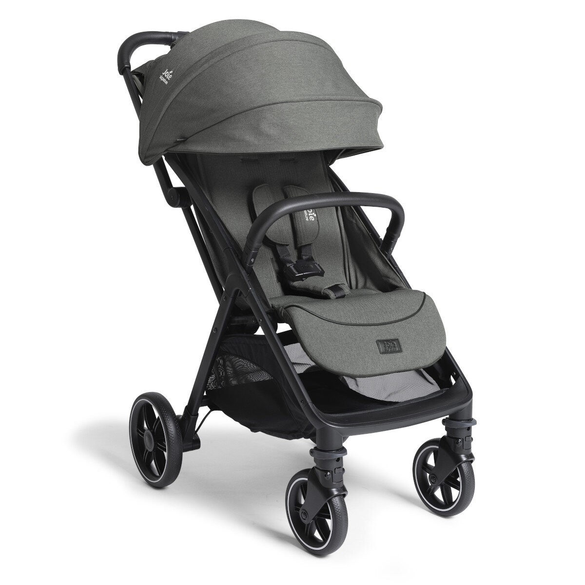 Compact Joie Signature Parcel LX buggy in evergreen green fabric, featuring a large canopy, adjustable harness, and black frame with four wheels, includes adapter, rain cover, and transport bag.
