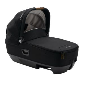 Nuna Cari Next Lay Flat Car Carrycot in black fabric with a soft gray interior, featuring a sturdy base, a retractable canopy, and a convenient carrying handle.