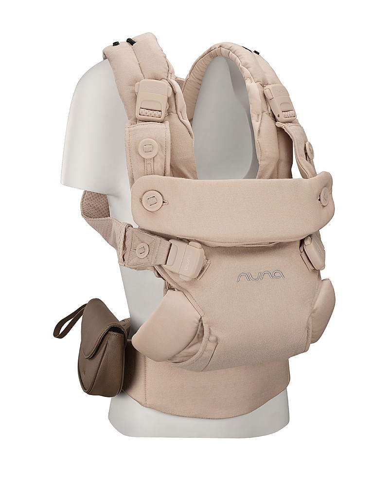 Beige Nuna Cudl Luxe Carrier featuring adjustable straps, padded support, and a detachable storage pouch, designed for comfort and convenience in carrying infants.