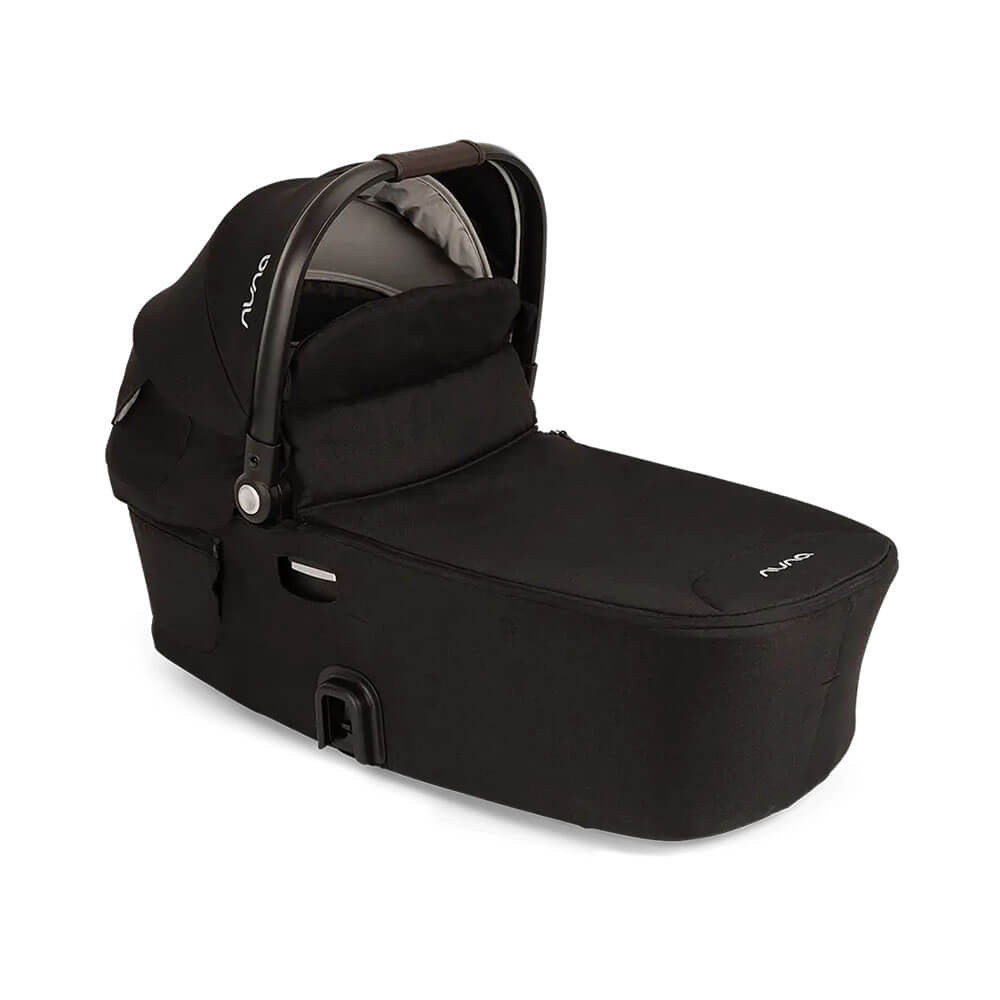 Black Nuna Demi Next Carry Cot with a soft fabric exterior, a padded interior, and a sturdy handle for easy transport.