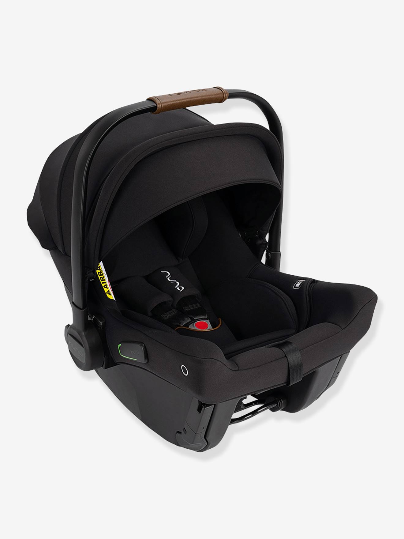 Nuna Pipa™ Urbn Car Seat in Caviar features a sleek black fabric exterior, a cushioned interior, and a stylish brown leather handle for easy carrying.