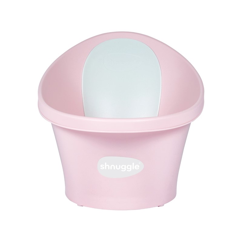 A pink plastic bath with a smooth white plug, featuring a rounded design and a comfortable backrest, ideal for infants and small children.