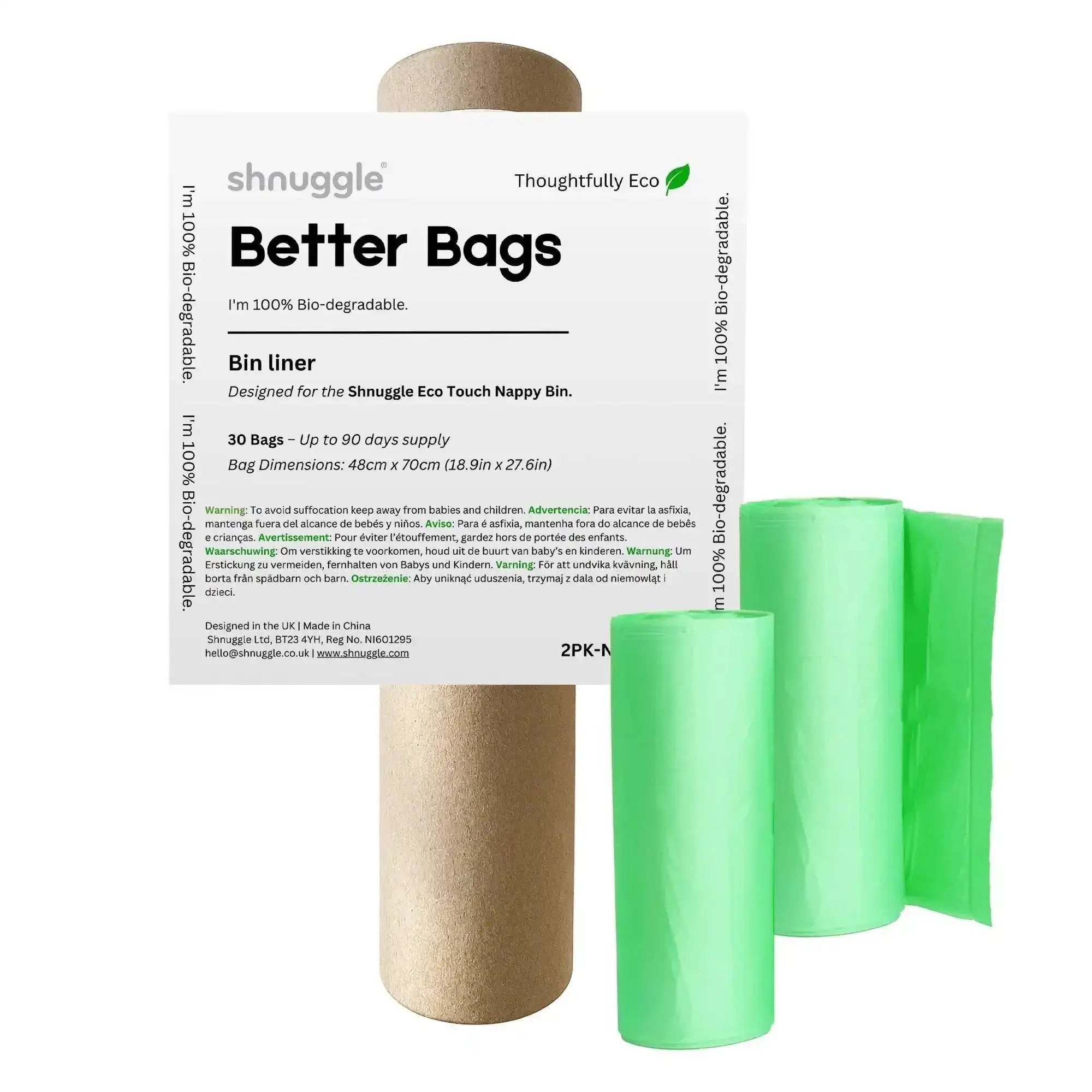Green biodegradable diaper pail liners packaged with a cardboard roll, featuring a label that highlights eco-friendliness and dimensions for the Shnuggle Eco Touch Nappy Bin.