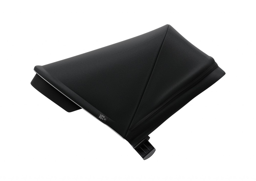 Midnight black Thule Spring sunshade made from durable fabric, featuring a sleek, angular design with a clip for easy attachment.