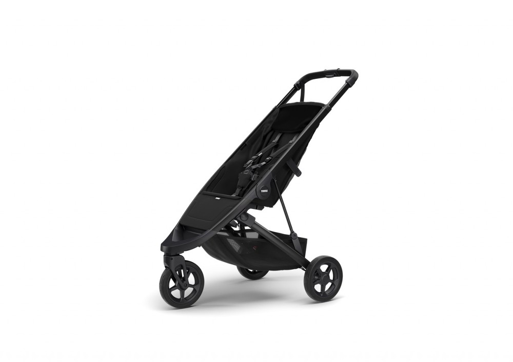 Black Thule Spring stroller frame with a sleek design, featuring a spacious seat, adjustable handlebar, and sturdy wheels for easy maneuverability.