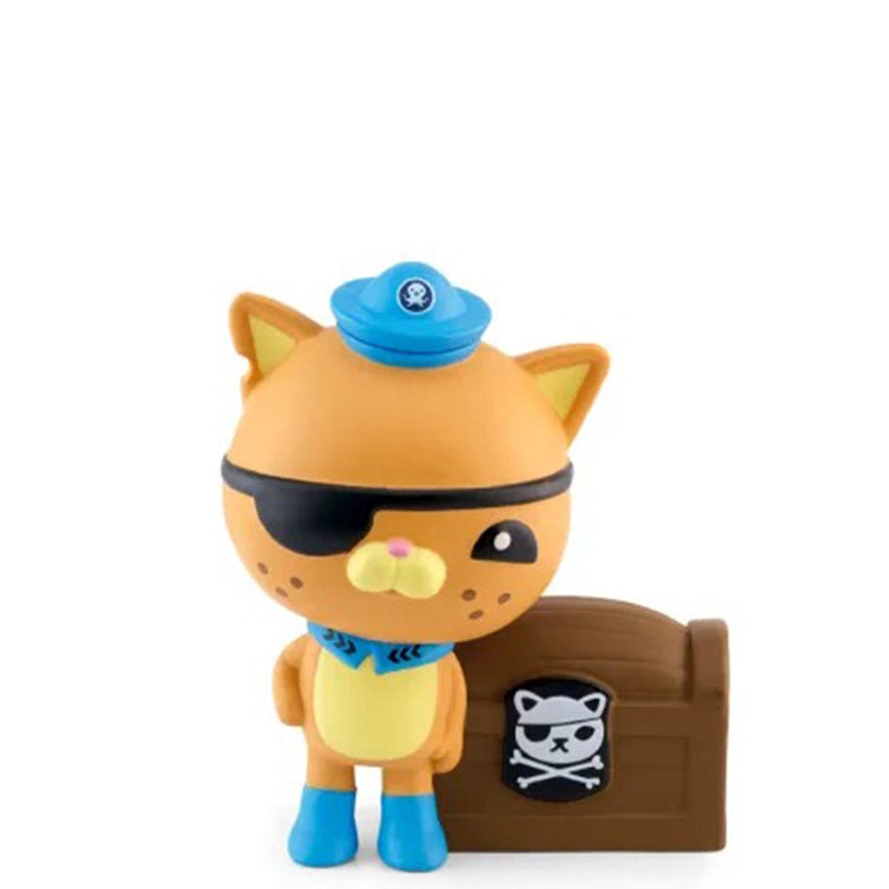 Kwazii, a playful orange cat character with an eye patch and blue hat, stands next to a brown treasure chest featuring a skull and crossbones design.