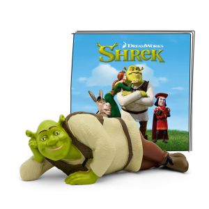 Green Shrek figure in a relaxed pose, wearing a brown vest and cream shirt, next to a colorful book cover featuring characters from the DreamWorks film "Shrek."