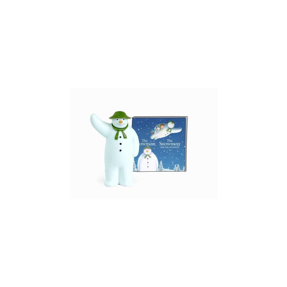 A white figurine of a snowman wearing a green hat and scarf, alongside a colorful box featuring the title "The Snowman and The Snowdog" with a snowy scene.