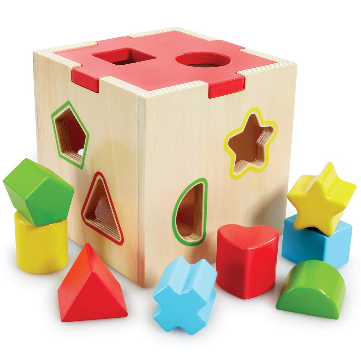 A wooden shape sorter cube with a natural finish, featuring colorful cut-out shapes in red, yellow, green, and blue, alongside matching geometric blocks.