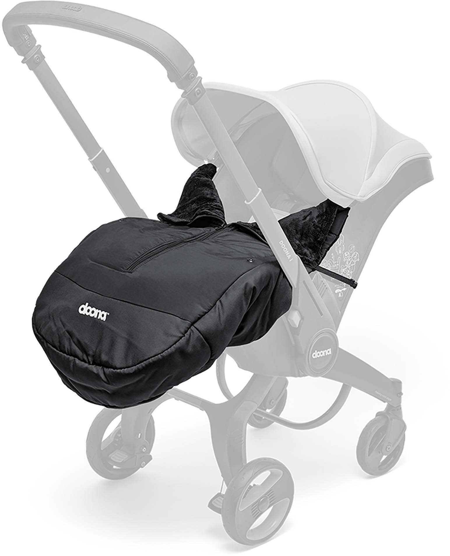 Black Doona Winter Cover with fleece lining, zipper closure, and tailored fit for infant car seat and stroller.