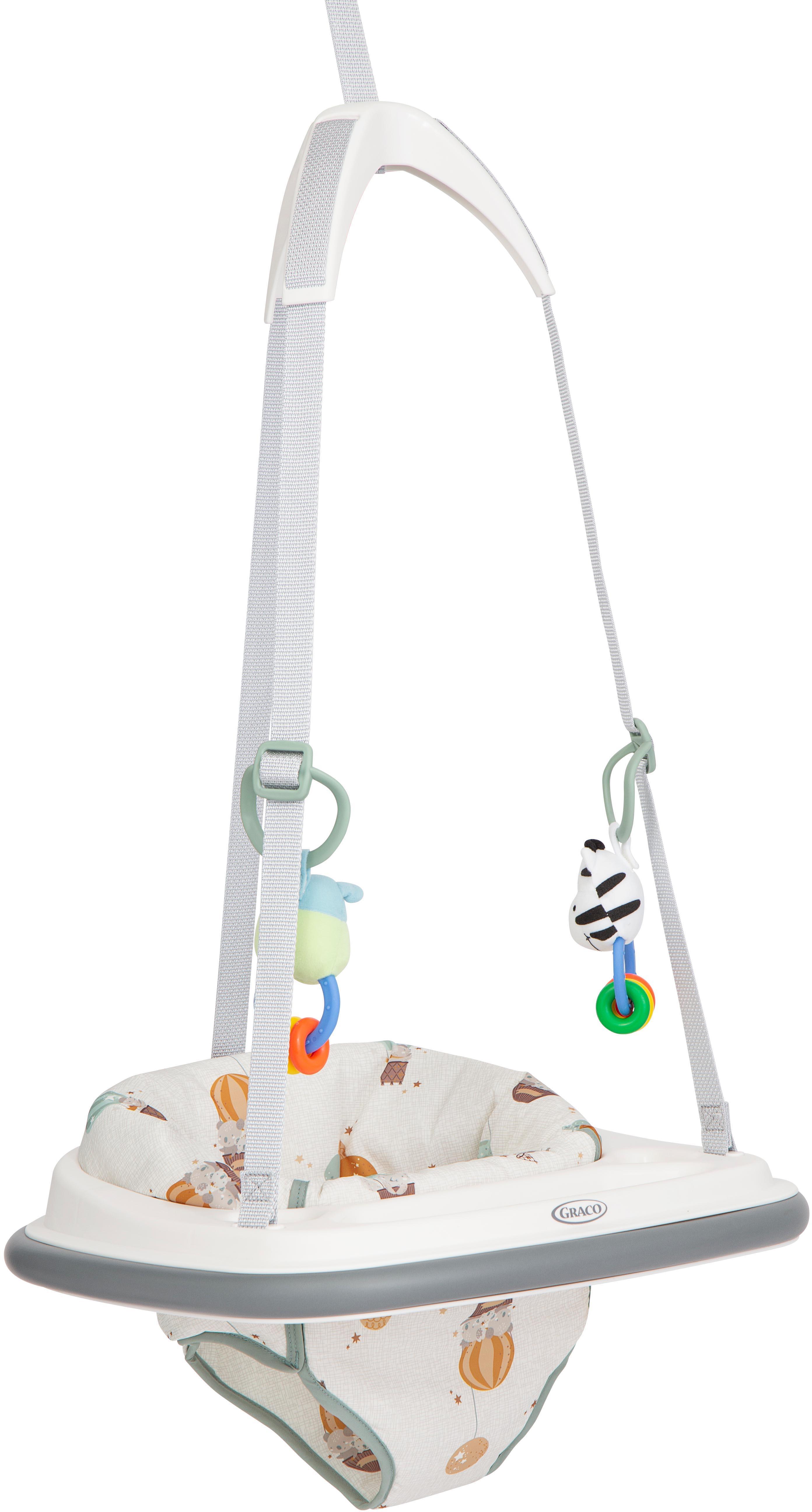 Graco Bumper Jumper with white frame, gray straps, and colorful hanging toys on a patterned seat.