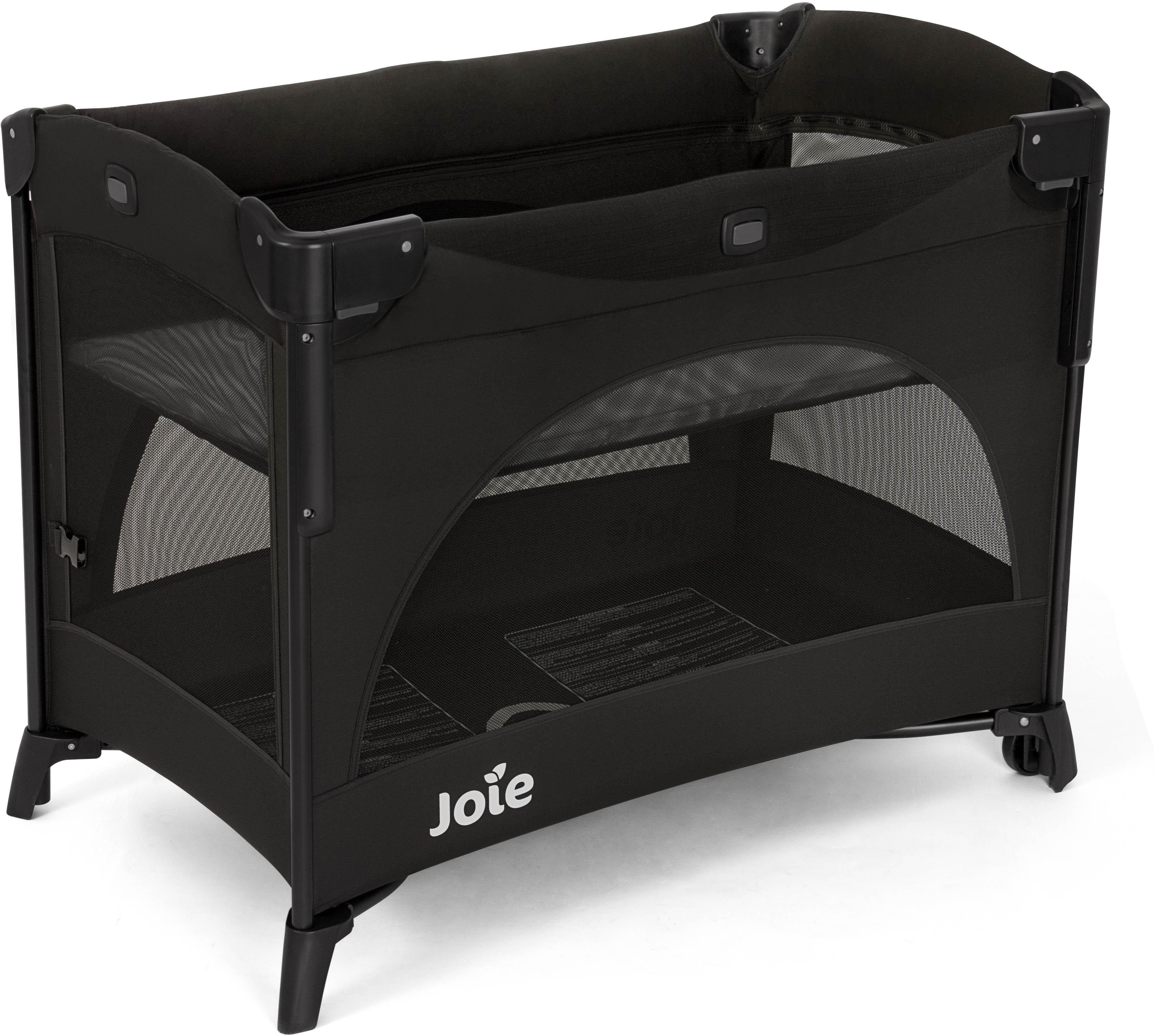 Joie Kubbie Sleep Travel Cot in Shale, black mesh sides, sturdy frame, compact design, and Joie logo on the base.