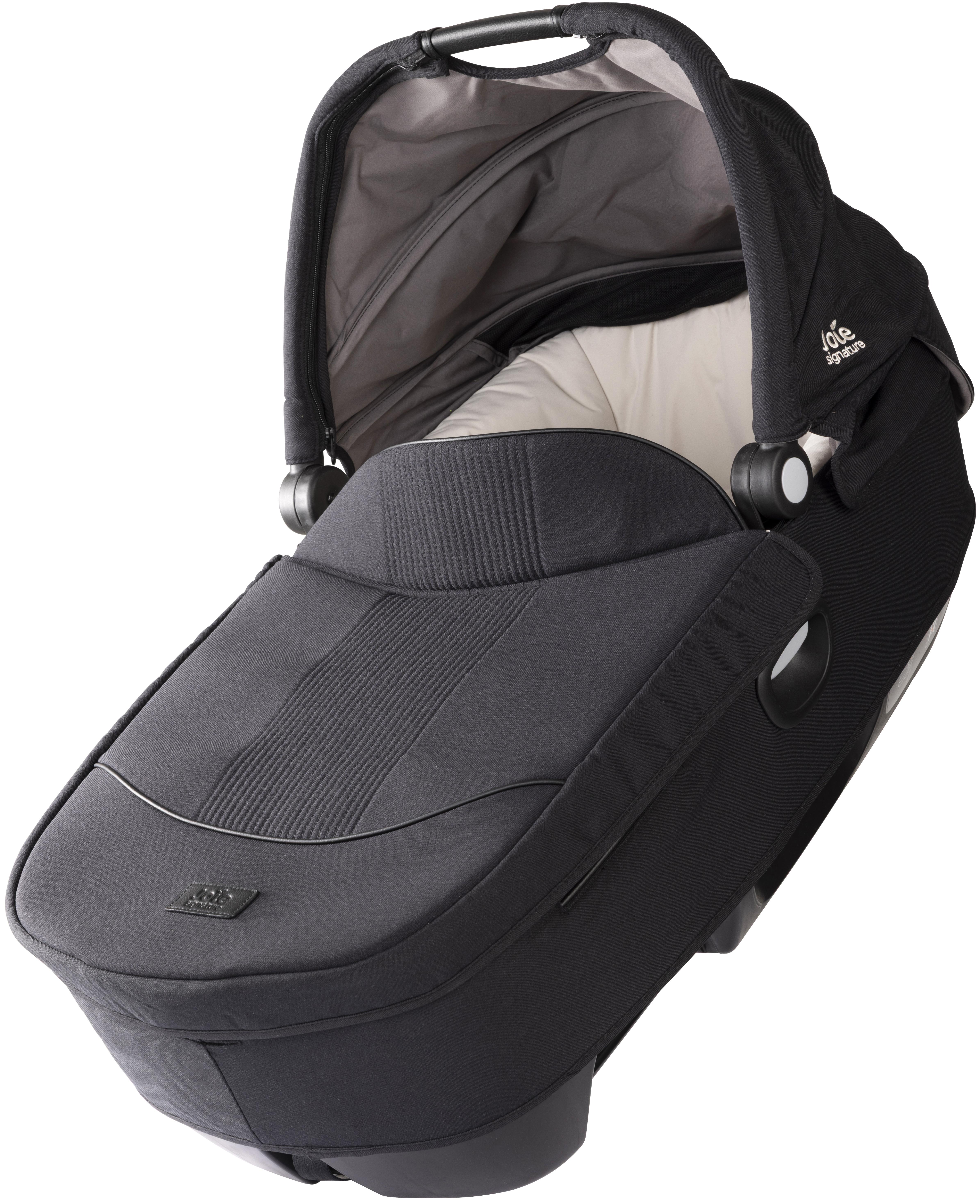 Black Joie Signature Calmi Carry Cot with padded interior, adjustable canopy, and sleek design.