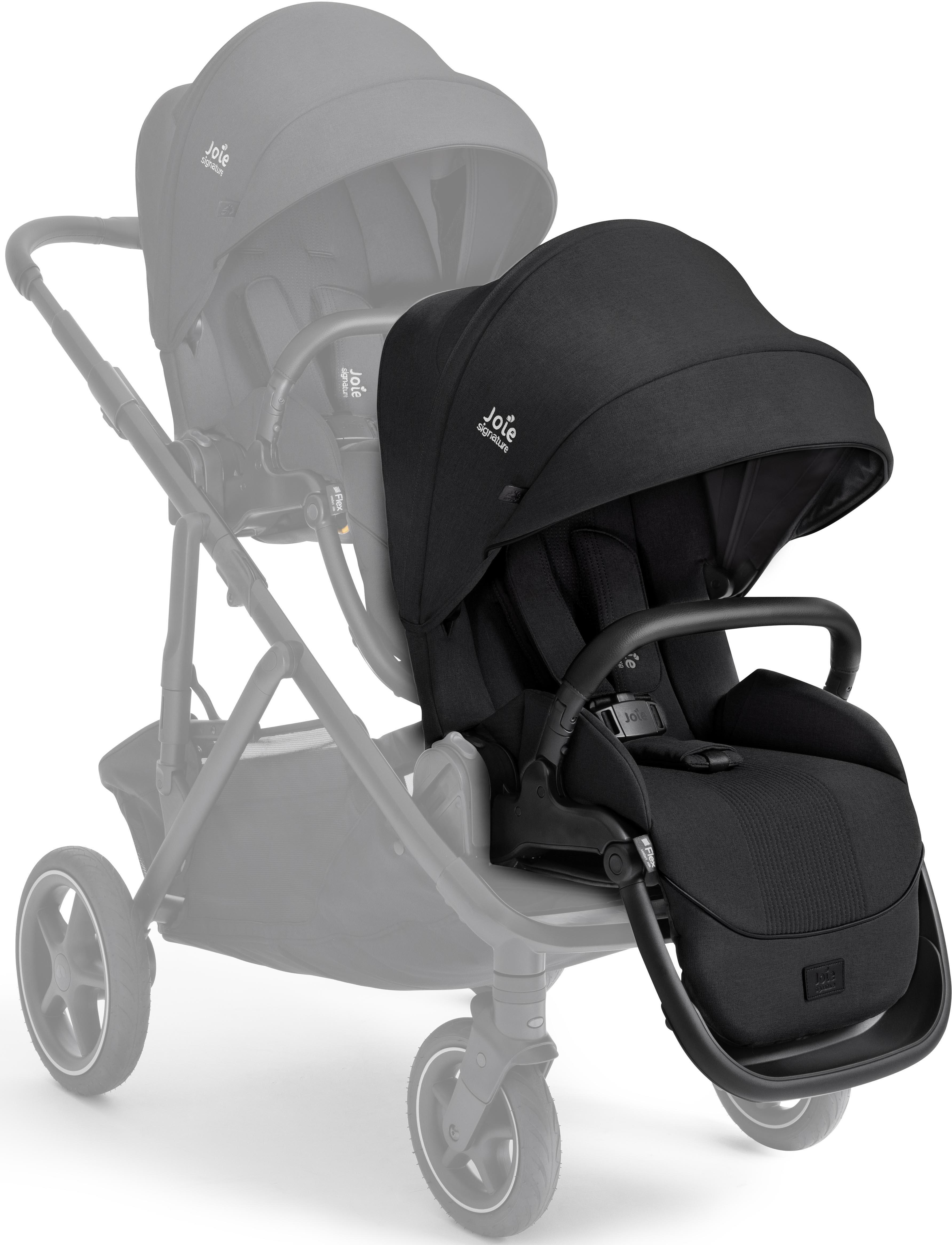 Black Joie Signature Versiti sibling seat with canopy, padded harness, and sleek design, attached to stroller frame.