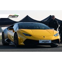 Yellow Lamborghini Huracán supercar on a track, sleek design, black accents, PSR Experience branding in the background.