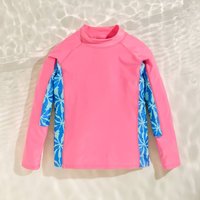 Pink Regatta Hoku II long-sleeved swim top, size 3-4 years, with blue palm leaf patterned side panels.