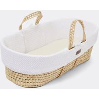 White organic cable knit Moses basket with wheat-colored woven base and handles.