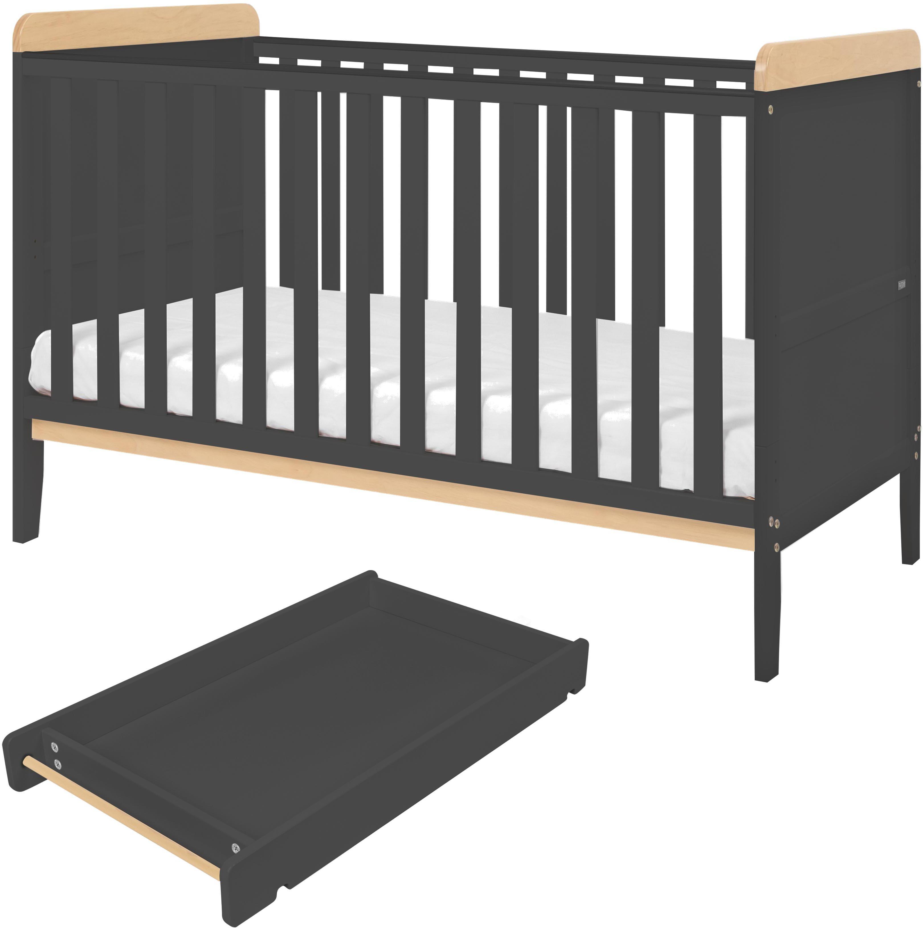 Slate gray cot bed with wooden accents, matching changer tray, and white mattress by Tutti Bambini.